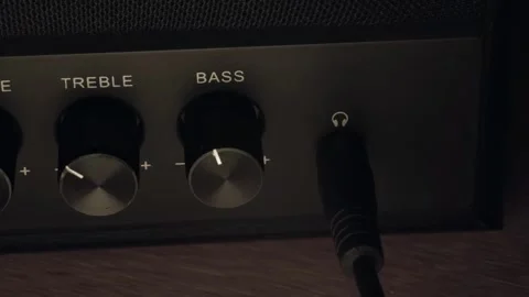 Plug the mini jack into the jack, plug the headphones into the speakers Stock Footage 264327798