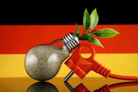 Plug, plant growing inside the light bulb and Germany Flag. Green eco renew.. Stock Photos