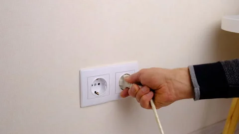 Plug the plug into the socket. Selective focus. Stock Footage 256982906