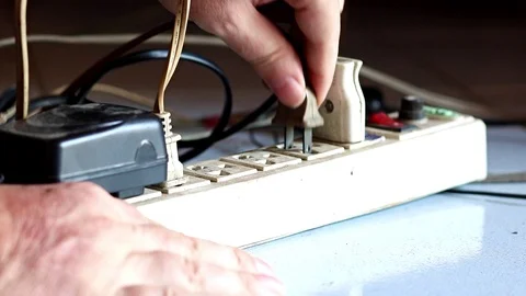 Plug in the plugs into the extended socket on the floor. Stock Footage 115191764