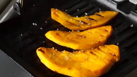 The plug presses the strips on the grill pan Stock Footage 72725884