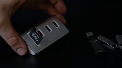 Plug in SD Card into USB Hub and turn unit Video stock 89635805