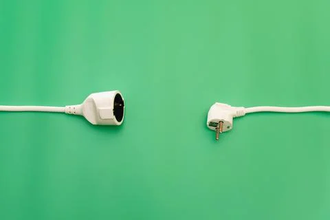 Plug socket on green background Stock Photos