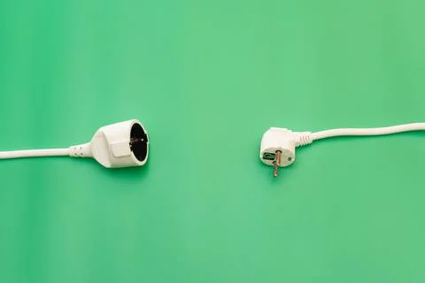 Plug socket on green background Stock Photos