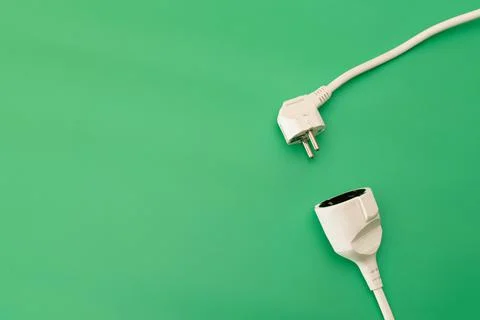Plug socket on green background Stock Photos