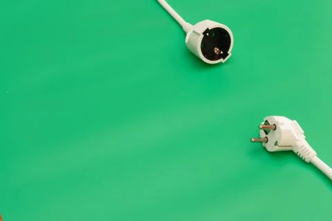 Plug socket on green background Stock Photos