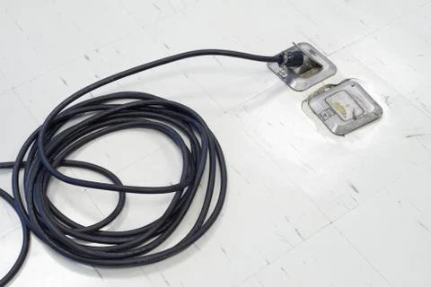 Plug Socket on the office floor that can be hidden or open up Stock Photos