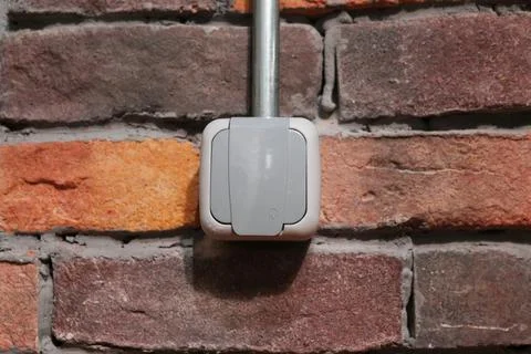 Plug socket with stone background in a cafeteria.Socket Stock Photos