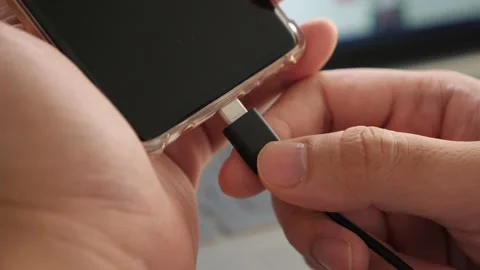 Plug in USB cord cable on smart phone, charging or and data transfer on mobil Stock Footage 149951650