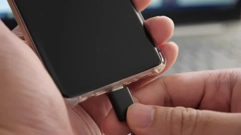 Plug in USB cord cable on smart phone, charging or and data transfer on mobil Stock Footage 150412020