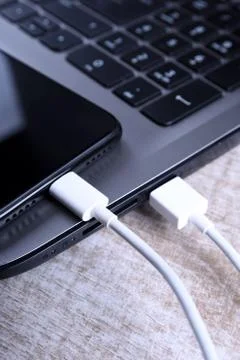 Plug in USB cord,cable charger,charging,charged and data transfer of the mobi Stock Photos