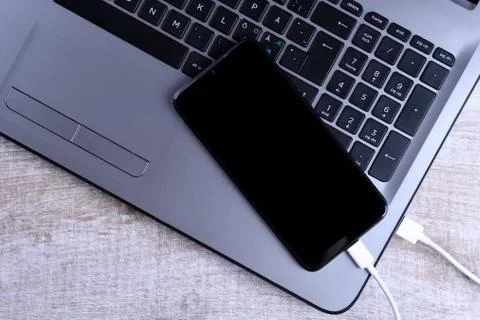 Plug in USB cord,cable charger,charging,charged and data transfer of the mobi Stock Photos
