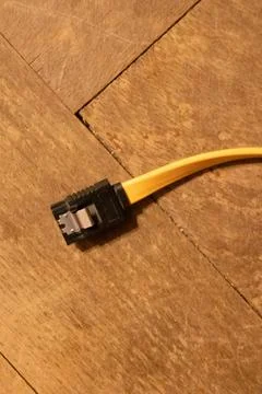 Plug wire from pc close up on wood background Stock Photos