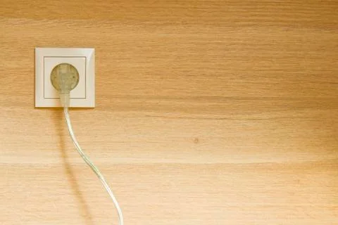 Plug in wooden wall Stock Photos