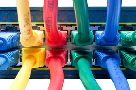 Plugged in - Colored Ethernet Cables Connected to Hub 写真素材