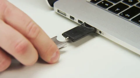 Plugging an Adapter to a Computer Stock Footage 70992815