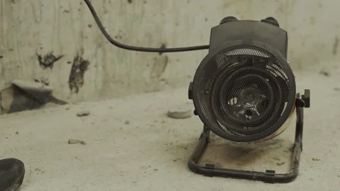 Plugging in and selecting the operating mode on the heater Stock Footage 154738723