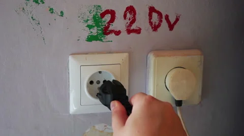 Plugging and sticking a plug into a socket Stock Footage 67476361