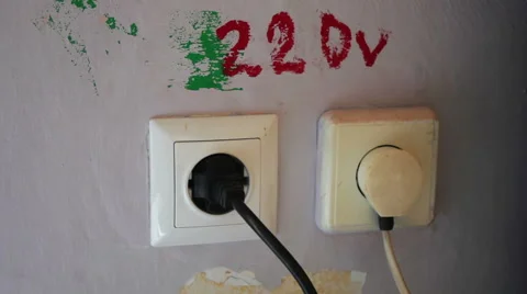 Plugging and sticking a plug into a socket Stock Footage 67476394