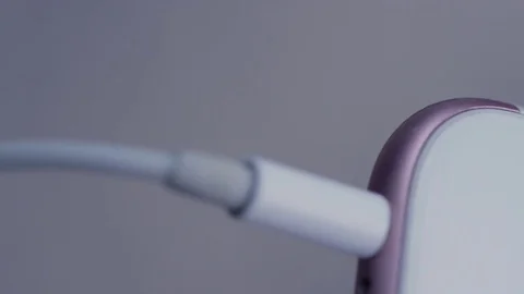 Plugging and unplugging headphones from jack, closeup Stock Footage 82824298
