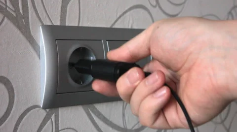 Plugging and unplugging a power adapter. Stock Footage 59089524