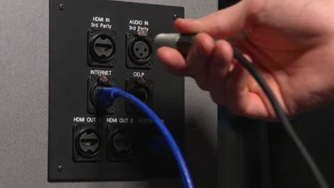 Plugging in audio and video cables Stock Footage 131628682