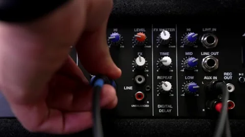 Plugging Audio Cables into Sound Mixer Interface Stock Footage 310139246