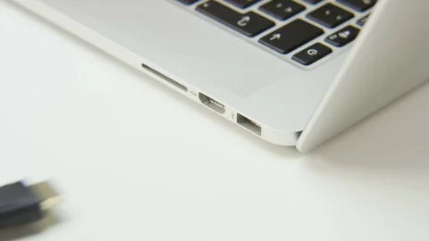 Plugging Black Cable to a Computer Stock Footage 70989959