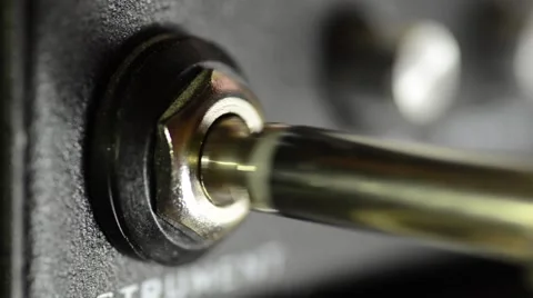 Plugging a Cable Into an Amplifier Video stock 50760260