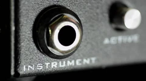 Plugging a Cable Into an Amplifier Video stock 50760282