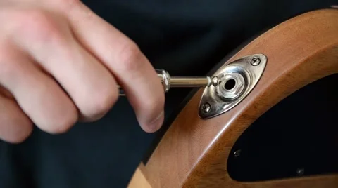 Plugging a Cable Into a Guitar Close Video stock 50710241