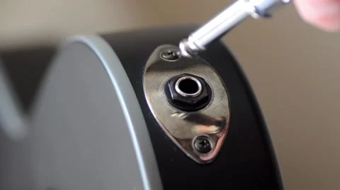 Plugging Cable Into a Guitar Stock Footage 49613654