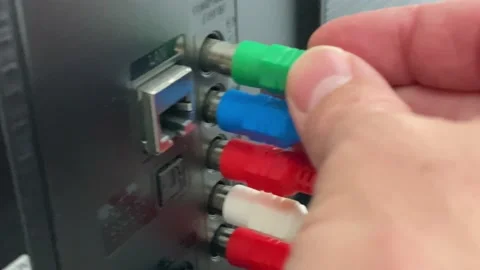 Plugging Component Cables In Back Of Flatscreen TV Stock Footage 143002505