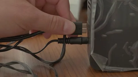 Plugging Computer Cable into Powered External Hard Drive Stock Footage 318473145