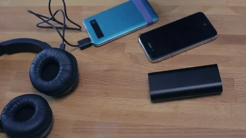 Plugging in devices to recharge. Video stock 90526816