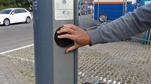 Plugging in elecric car charger Video stock 109443439