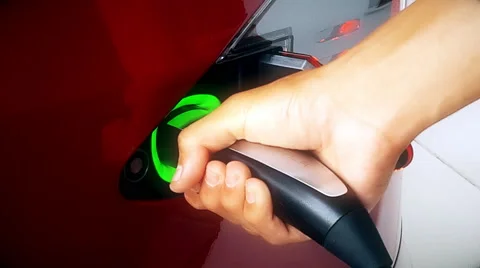 Plugging Electric Car Charger 4K Stock Footage 51933458