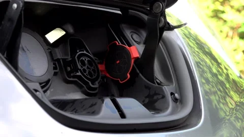 Plugging in an electric car Stock Footage 131538945