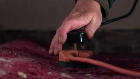 Plugging in electric power extension cable Stock Footage 291136735