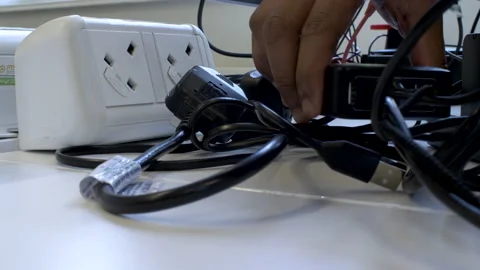 Plugging Electronic Devices Into Electricity Plug Socket And Attaching USB Stock Footage 200685979