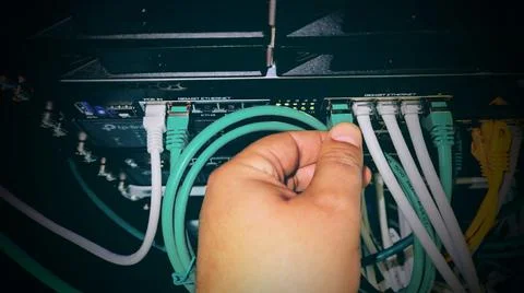 Plugging in an ethernet cable Stock Photos