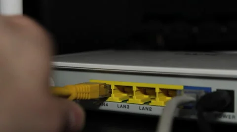 Plugging Ethernet into Router 動画素材 47297268