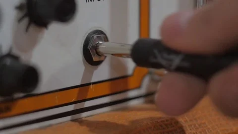 Plugging in guitar cable Video stock 73673312