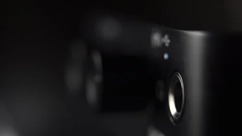 Plugging in headphone jack in audio interface at home music studio Stock Footage 107983144