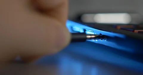 Plugging In Headphone Jack Stock Footage 89596655