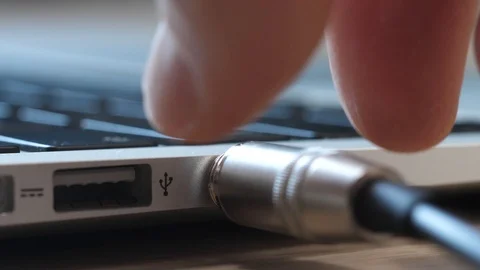 Plugging Headphones Cable Into Laptop Computer Audio Jack Closeup Stock Footage 90055318