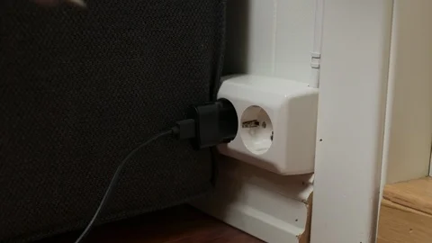 Plugging inn electrical socket Stock Footage 127197712