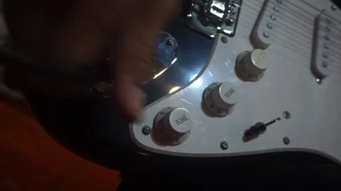Plugging A Jack Into Electric Guitar. Close up. Stock Footage 149002851