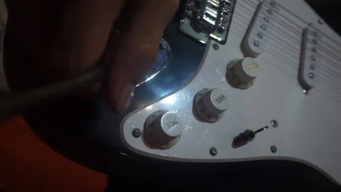 Plugging A Jack Into Electric Guitar. Close Up. Stock Footage 149005105