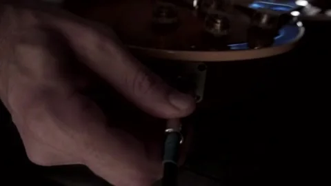 Plugging a jack into electric guitar Stock Footage 93952282